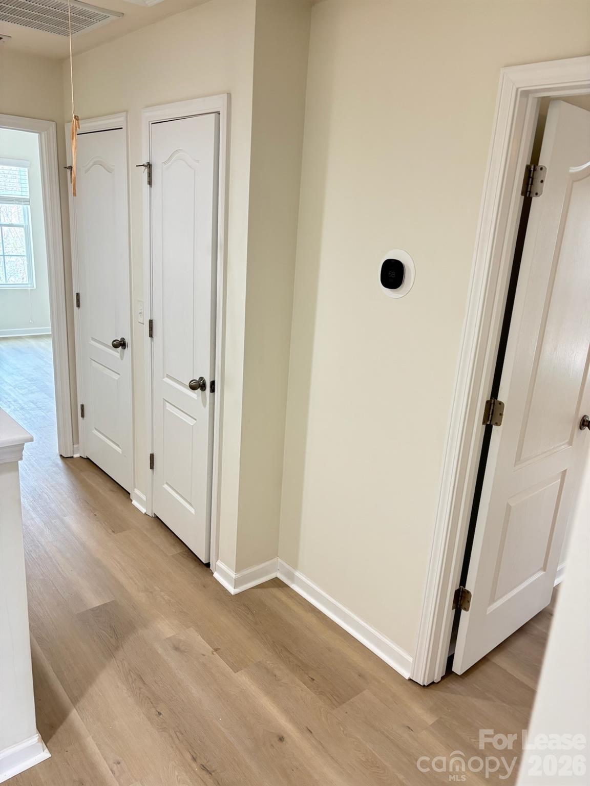 17924 Ragtop Day Lane Cornelius, NC 28031 - Photo 29 of 47 a view of a hallway with wooden floor and staircase