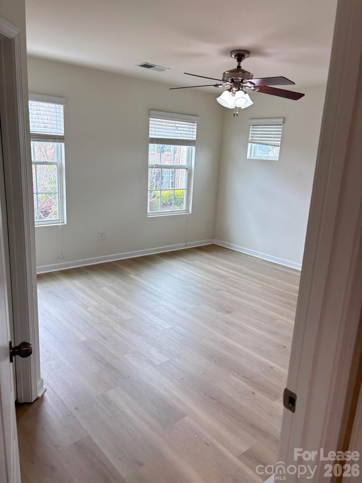 17924 Ragtop Day Lane Cornelius, NC 28031 - Photo 32 of 47 wooden floor in an empty room with a window