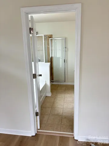 a white bath tub sitting next to a window
