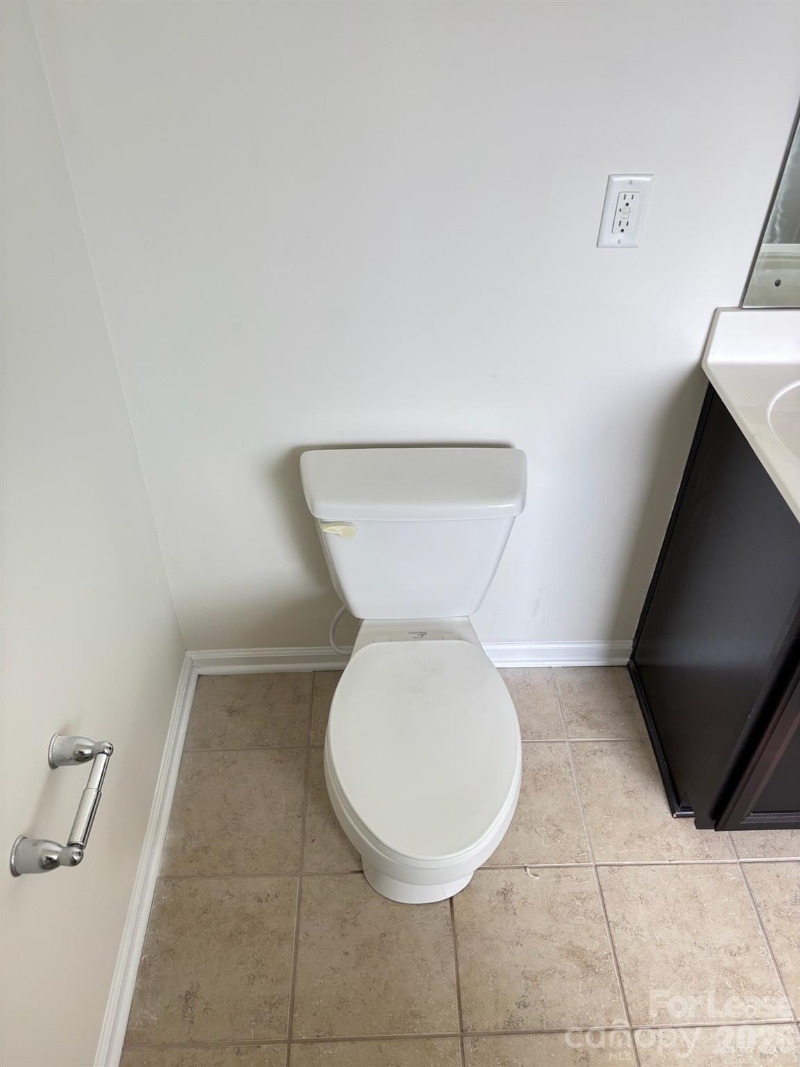 17924 Ragtop Day Lane Cornelius, NC 28031 - Photo 39 of 47 a bathroom with a toilet and a mirror