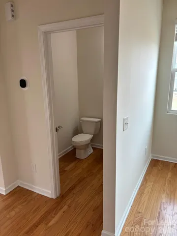 a view of a bathroom with wooden floor