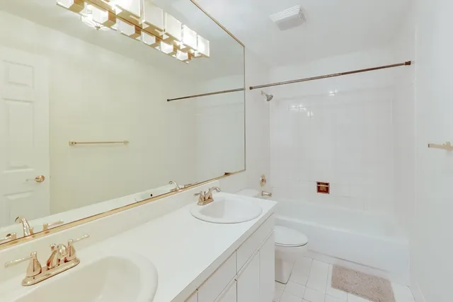 a bathroom with a sink a toilet and a bathtub