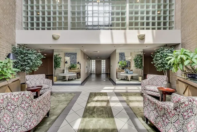 a front view of a house with outdoor seating