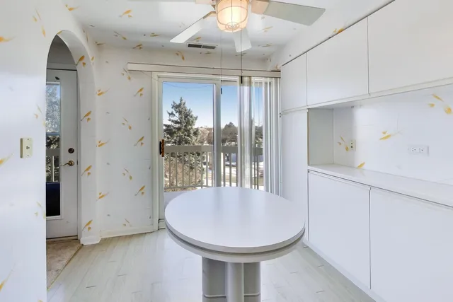 a view of kitchen with furniture and wooden floor