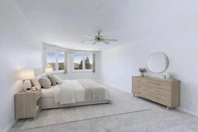 a bedroom with a bed and window