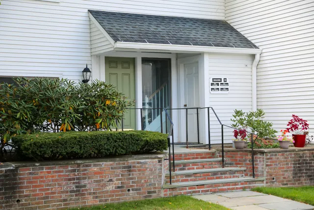 a front view of a house having yard