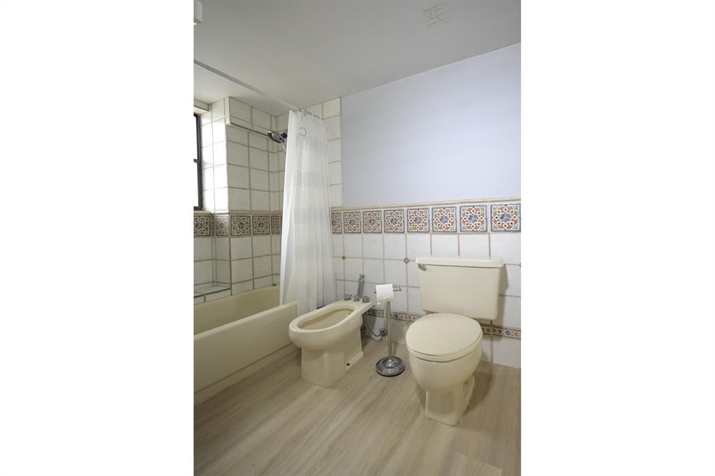 1775 Washington Avenue, Unit 5A Miami Beach, FL 33139 - Photo 11 of 21 a bathroom with a toilet and a shower