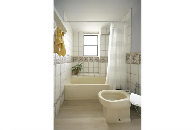 a bathroom with a toilet a sink and a bathtub