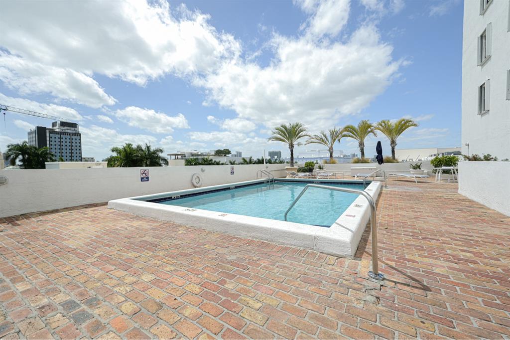 1775 Washington Avenue, Unit 5A Miami Beach, FL 33139 - Photo 17 of 21 a view of a swimming pool with a lounge chairs