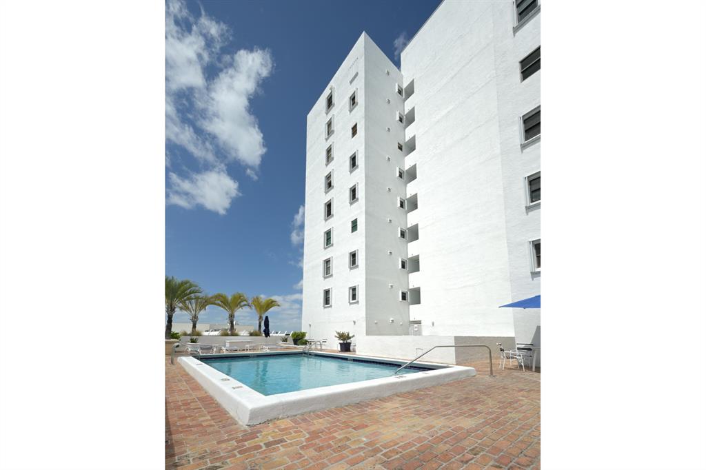 1775 Washington Avenue, Unit 5A Miami Beach, FL 33139 - Photo 18 of 21 a bathroom with a granite countertop bathtub and sink
