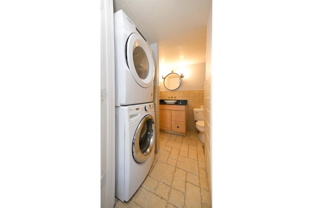 1775 Washington Avenue, Unit 5A Miami Beach, FL 33139 - Photo 7 of 21 a utility room with dryer and washer