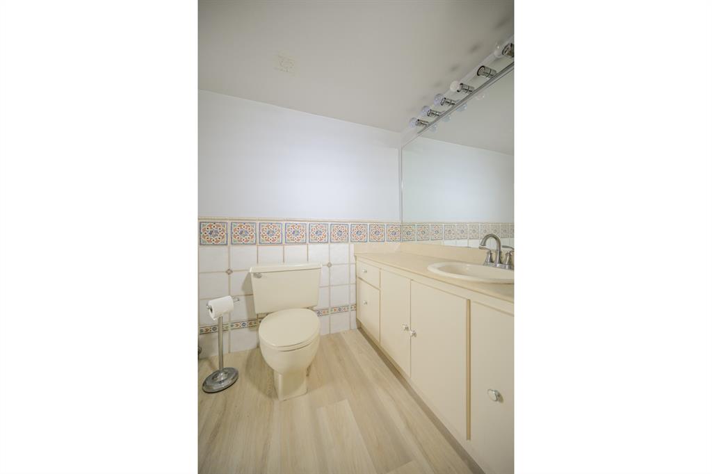 1775 Washington Avenue, Unit 5A Miami Beach, FL 33139 - Photo 10 of 21 a bathroom with a sink a toilet and shower