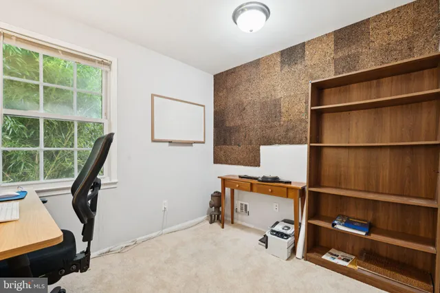 a view of workspace with furniture and window