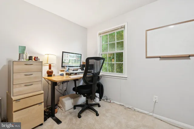 a view of a workspace with furniture