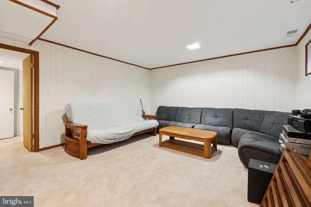 a living room with furniture and a couch