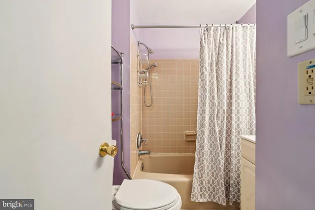 a bathroom with a sink a mirror and a shower curtain