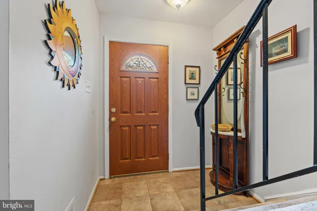 a view of an entryway with wooden floor