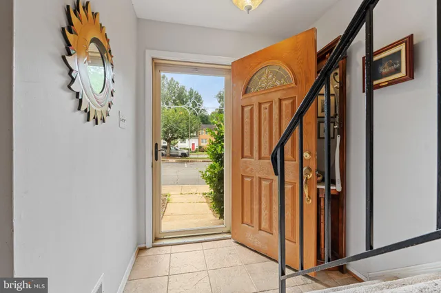 a view of an entryway with wooden floor and door