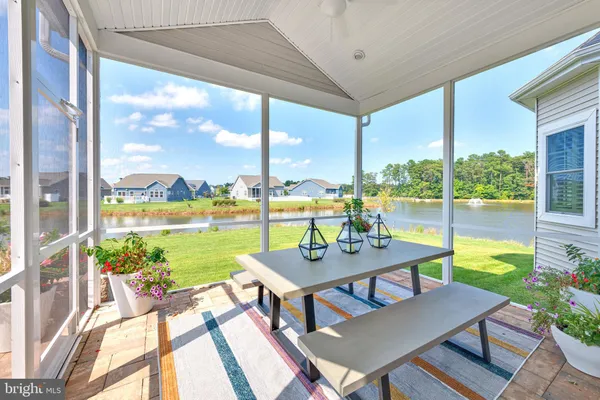 a view of a porch with furniture and garden