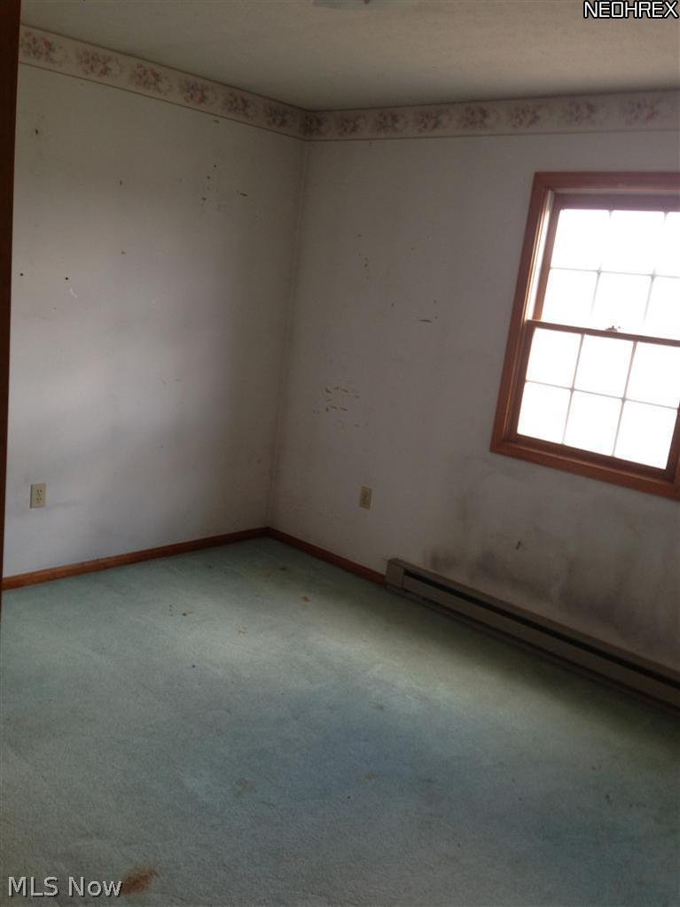 9200 River Corners Road Homerville, OH 44235 - Photo 15 of 25 Bedroom 3 offers a long closet with extra storage area.