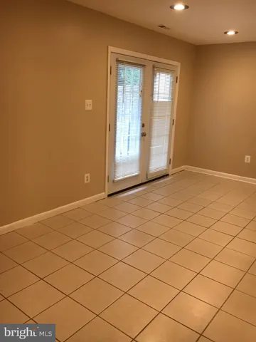 a view of an empty room and a window