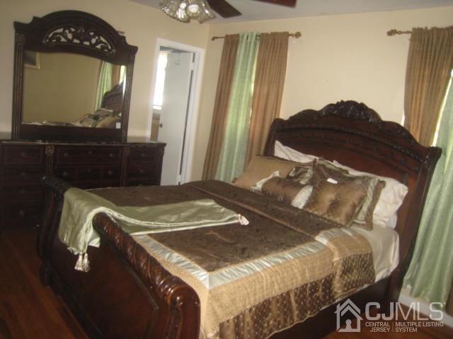 22 King Road Somerset, NJ 08873 - Photo 11 of 19 a bedroom with a bed and a mirror