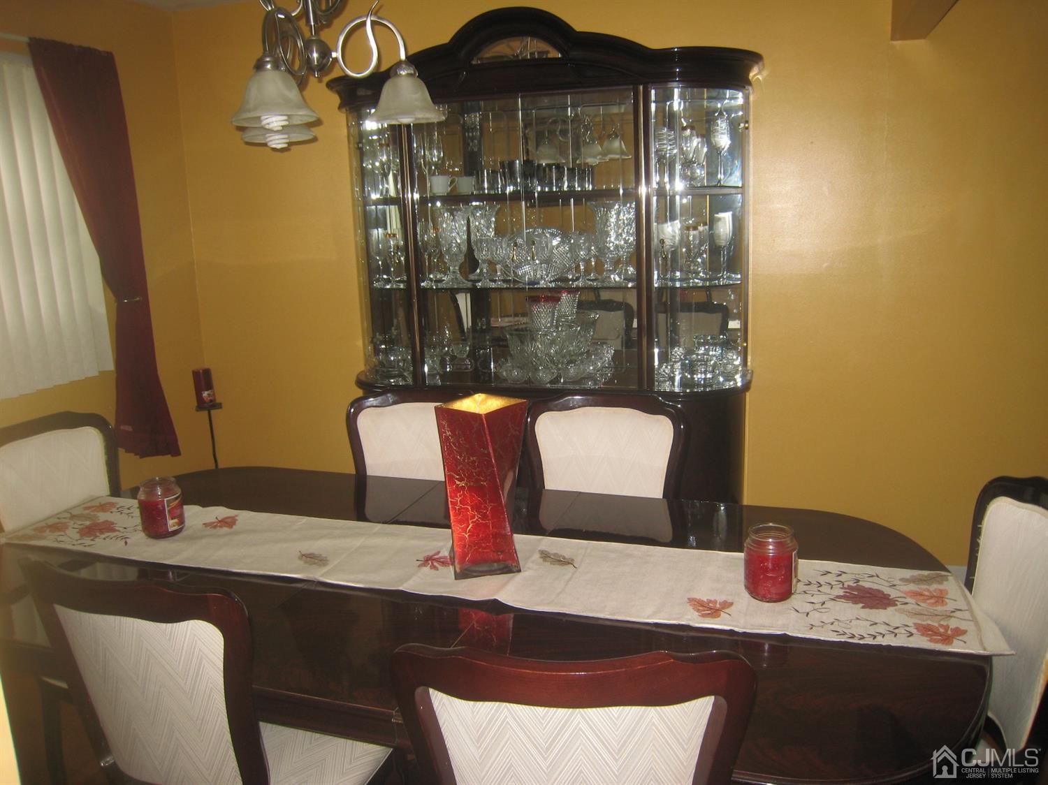 22 King Road Somerset, NJ 08873 - Photo 14 of 19 a dining room with a table and chairs