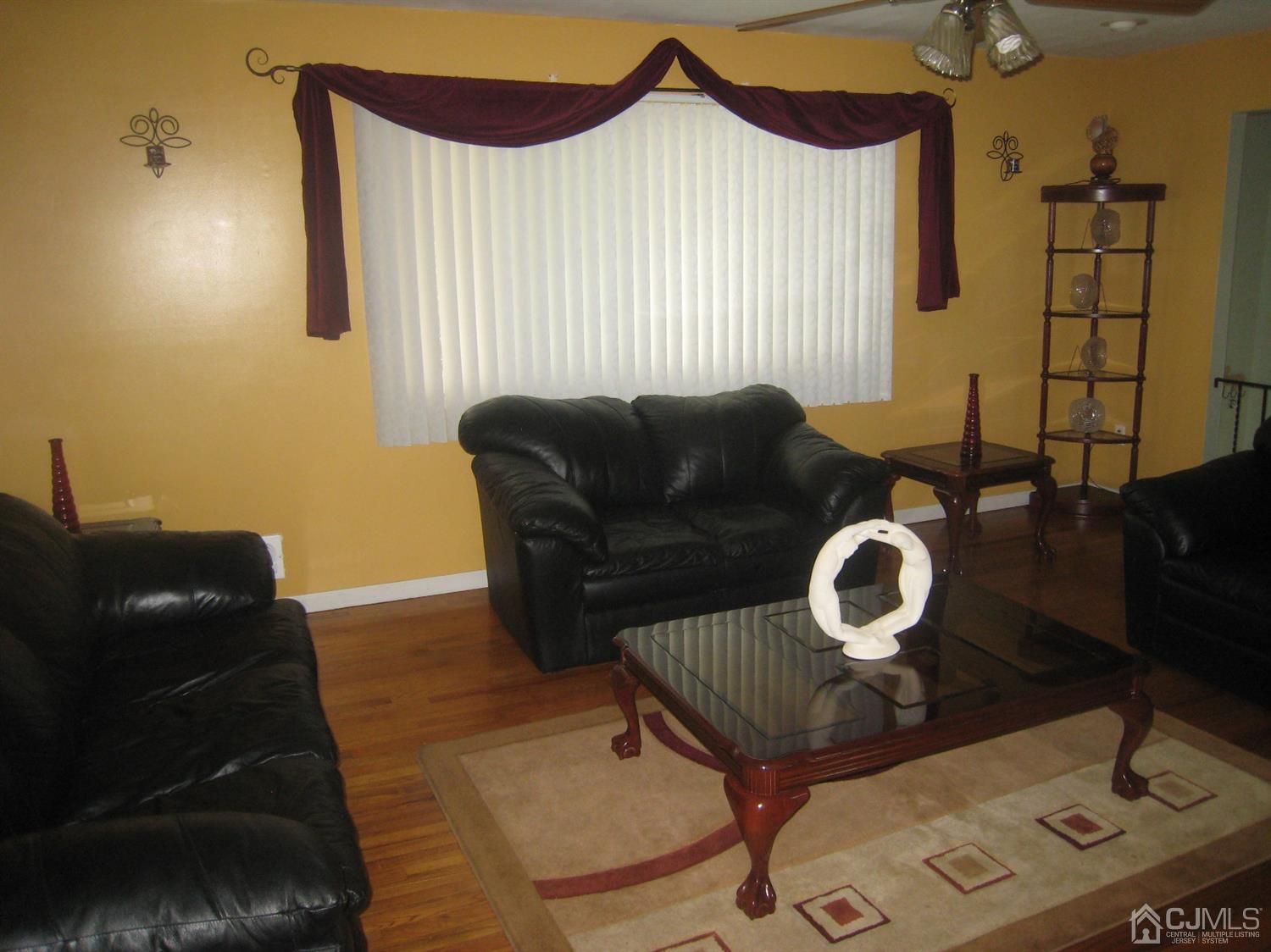22 King Road Somerset, NJ 08873 - Photo 15 of 19 a living room with furniture and wooden floor