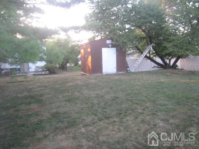 22 King Road Somerset, NJ 08873 - Photo 18 of 19 a street view with large trees
