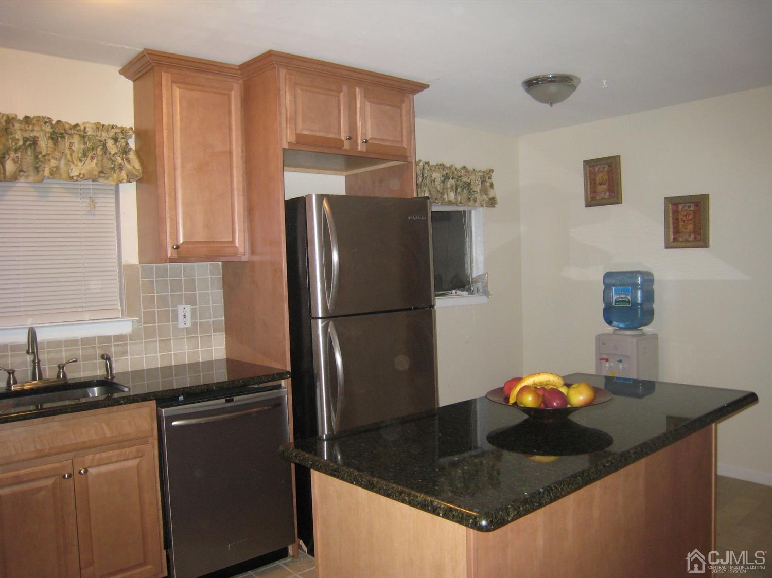 22 King Road Somerset, NJ 08873 - Photo 6 of 19 a kitchen with granite countertop a refrigerator a stove and a sink
