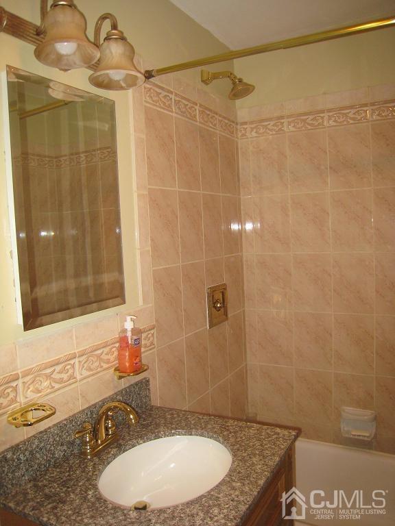 22 King Road Somerset, NJ 08873 - Photo 7 of 19 a bathroom with a granite countertop sink toilet and shower