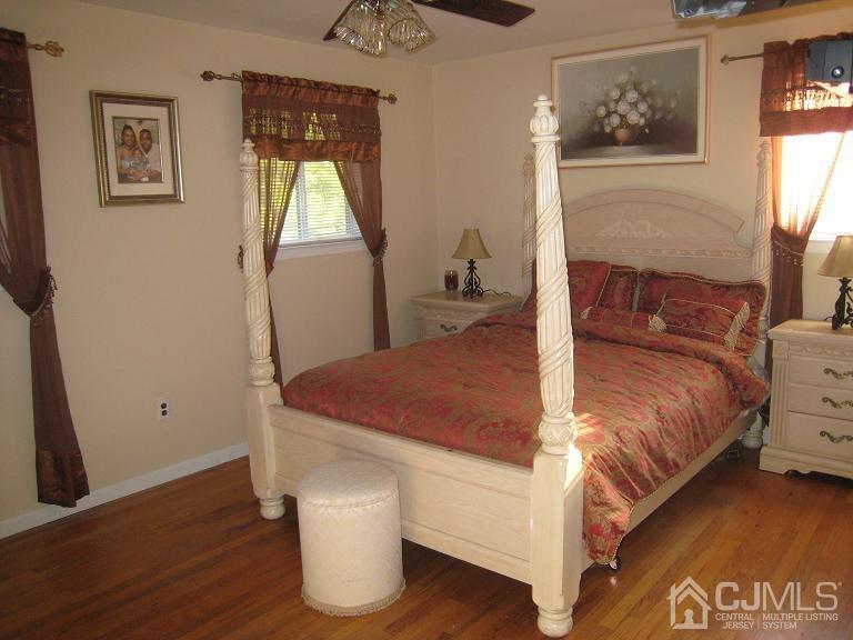 22 King Road Somerset, NJ 08873 - Photo 9 of 19 a bed sitting in a bedroom next to a window
