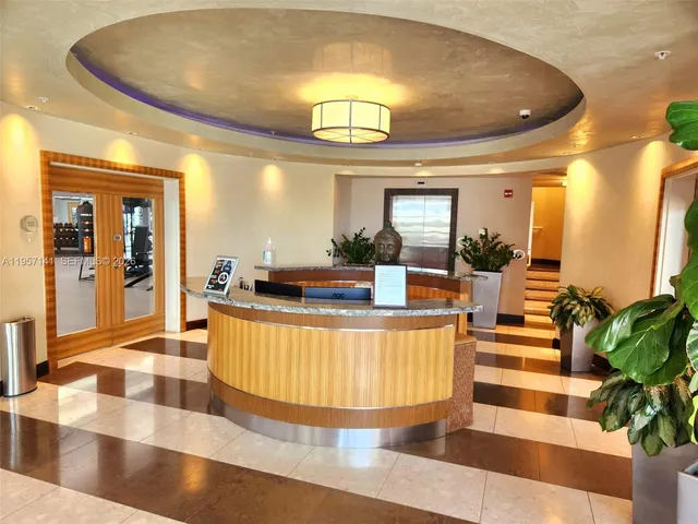 a view of a lake with a house in the background