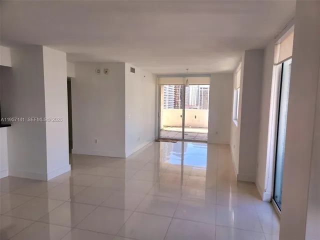 a view of an empty room and window