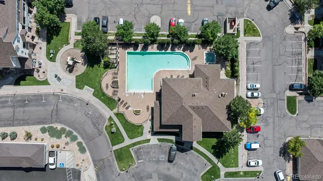 an aerial view of a house with a garden and a yard