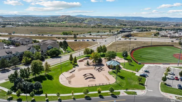 an aerial view of a house with outdoor space and lake view