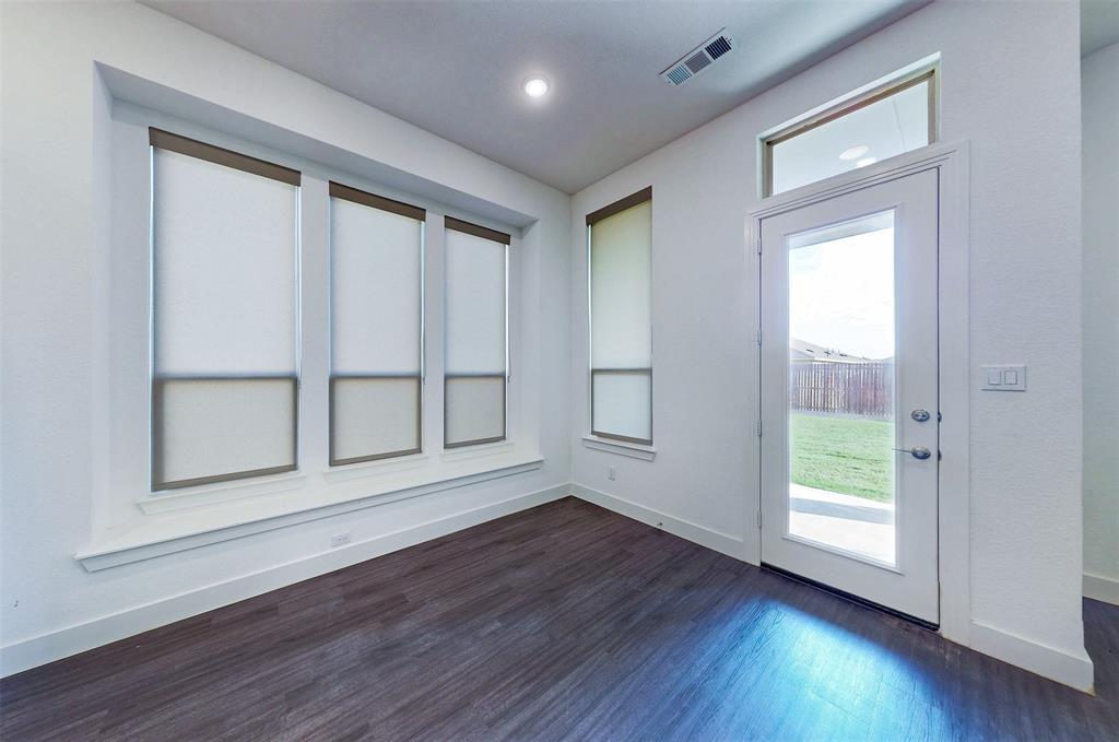 2032 Longbridge Road Forney, TX 75126 - Photo 15 of 40 a view of wooden floor and windows in a room