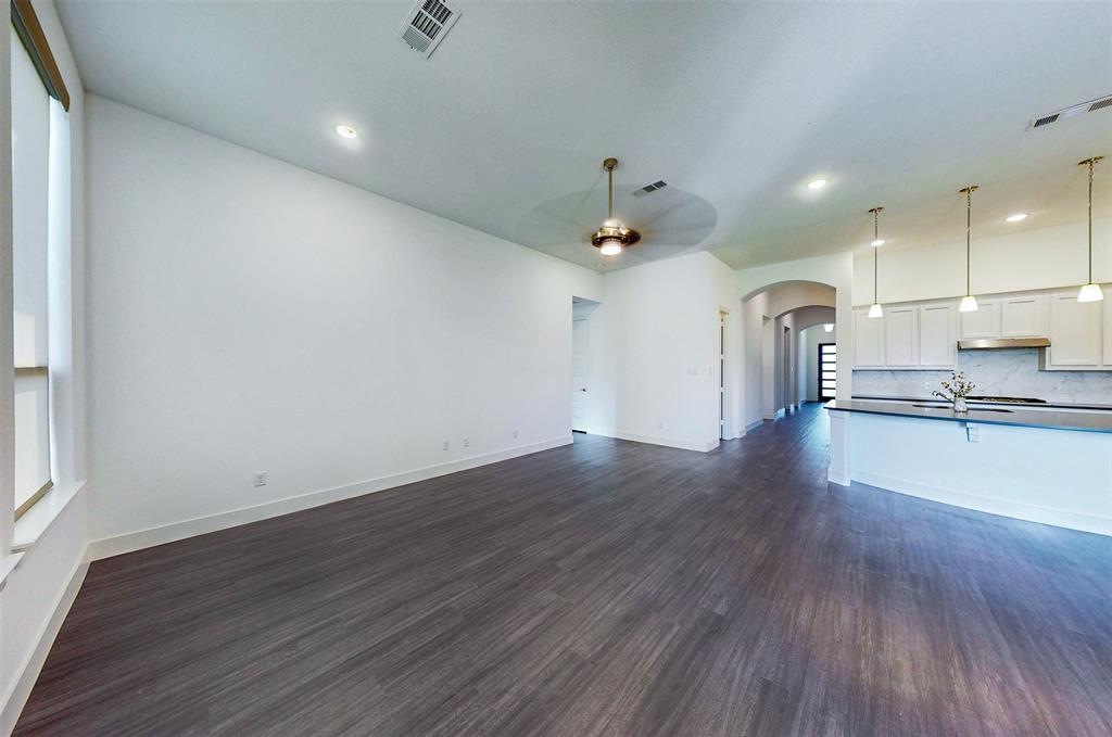 2032 Longbridge Road Forney, TX 75126 - Photo 17 of 40 a view of a kitchen with a sink and a stove top oven
