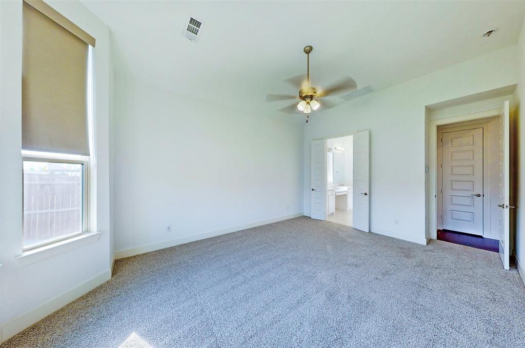 2032 Longbridge Road Forney, TX 75126 - Photo 23 of 40 an empty room with chandelier fan and windows