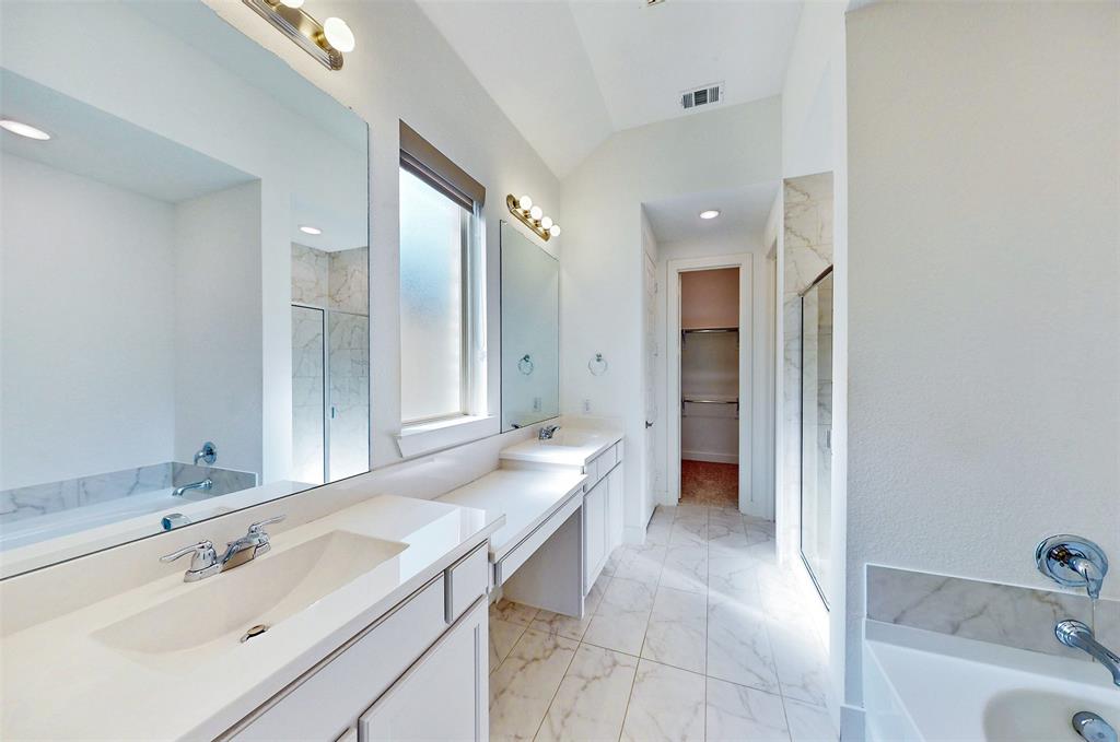 2032 Longbridge Road Forney, TX 75126 - Photo 24 of 40 a bathroom with a tub sink and mirror