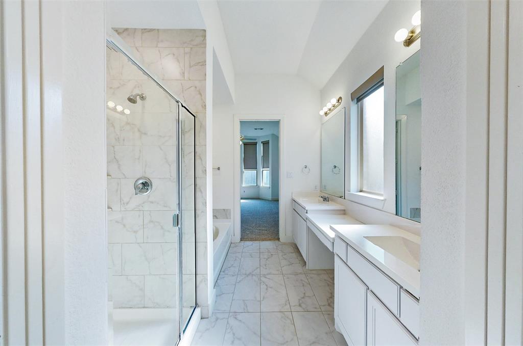 2032 Longbridge Road Forney, TX 75126 - Photo 26 of 40 a bathroom with a double vanity sink and mirror with shower