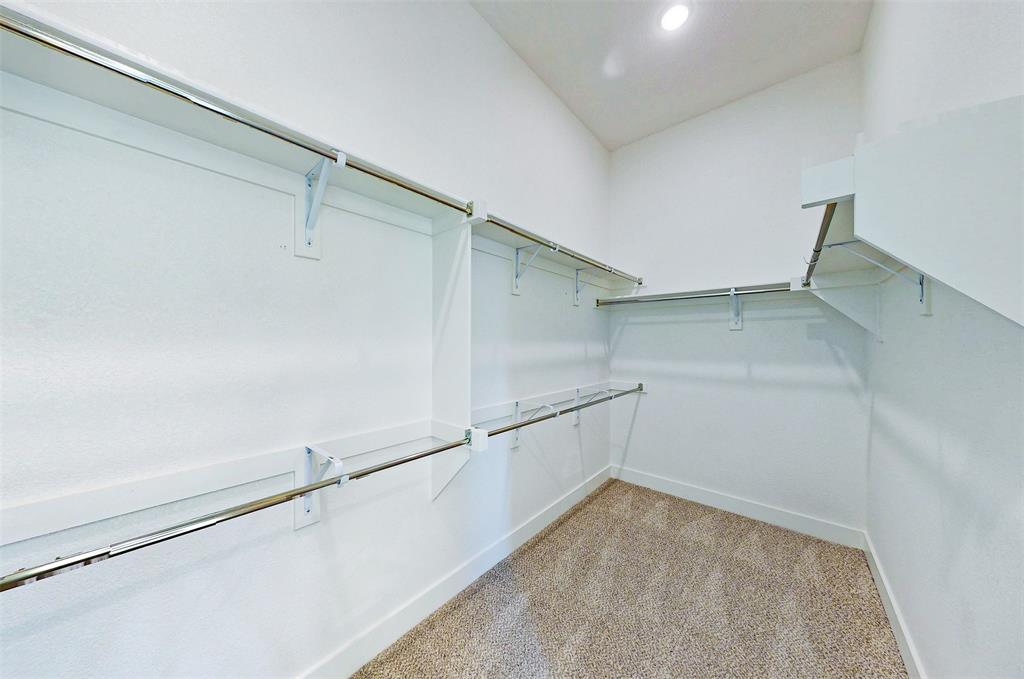 2032 Longbridge Road Forney, TX 75126 - Photo 27 of 40 a view of a room with racks on the wall