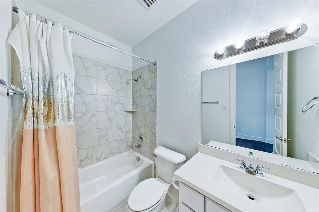 2032 Longbridge Road Forney, TX 75126 - Photo 29 of 40 a bathroom with a sink toilet and shower
