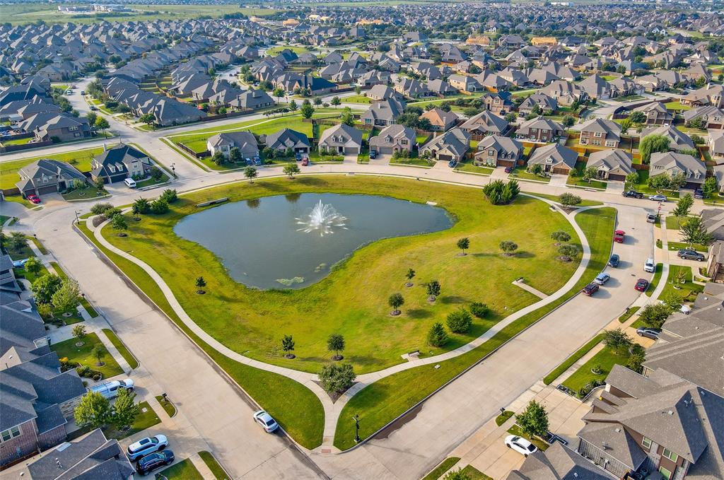 2032 Longbridge Road Forney, TX 75126 - Photo 35 of 40 an aerial view of a swimming pool with outdoor seating and yard