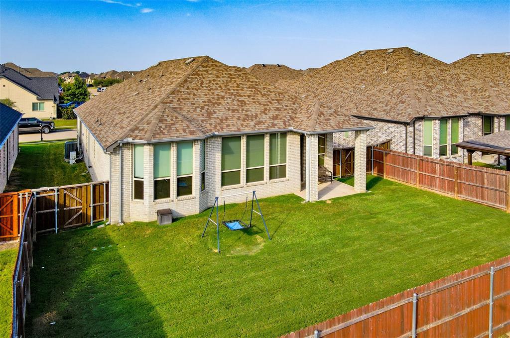 2032 Longbridge Road Forney, TX 75126 - Photo 38 of 40 a view of a house with a backyard