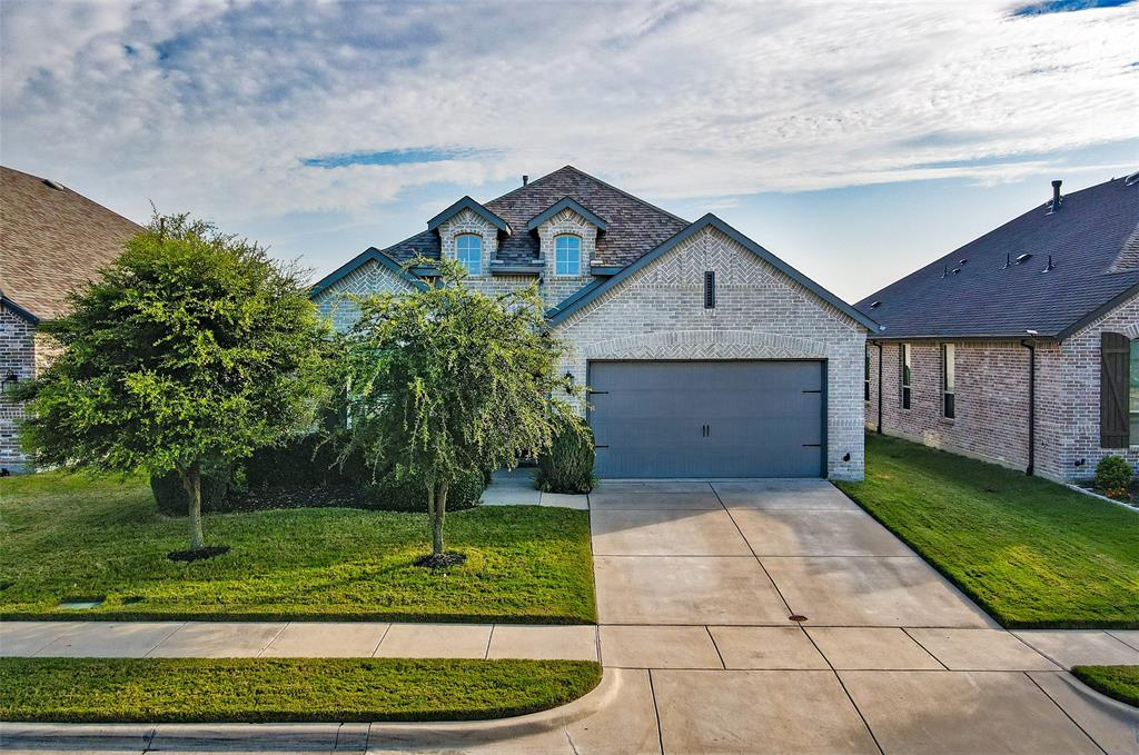 2032 Longbridge Road Forney, TX 75126 - Photo 4 of 40 a front view of a house with a garden