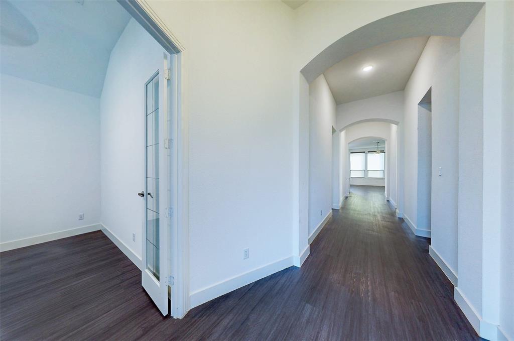 2032 Longbridge Road Forney, TX 75126 - Photo 6 of 40 a view of a hallway with wooden floor
