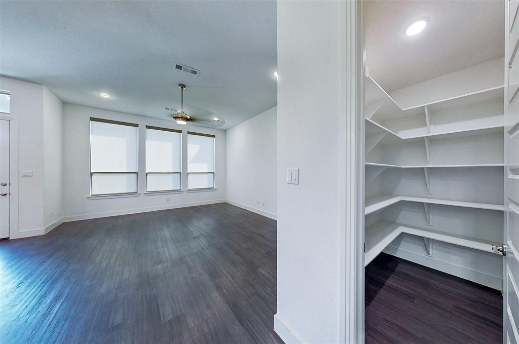 2032 Longbridge Road Forney, TX 75126 - Photo 8 of 40 a view of an empty room with a window and wooden floor