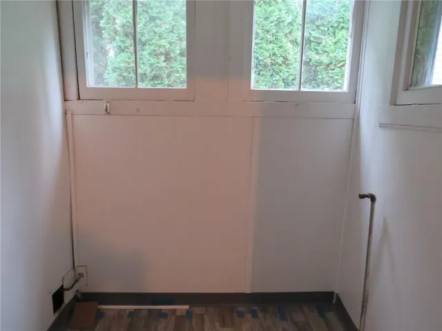 a bathroom with a tub and shower