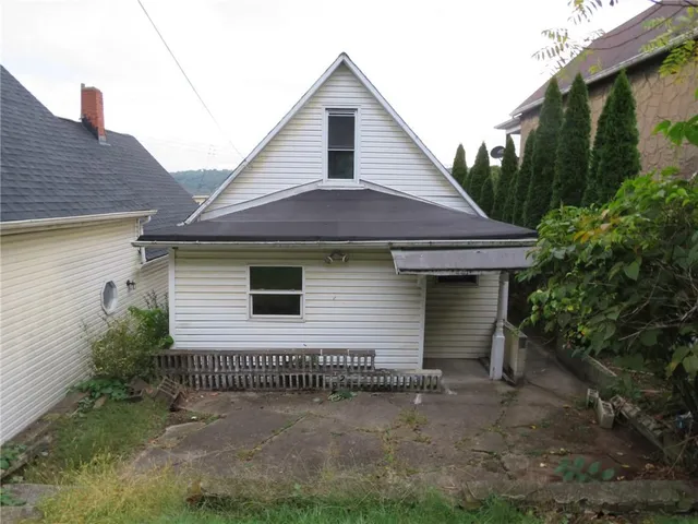 a front view of a house with garage